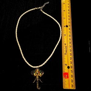 Multi colored elephant pendant on faux leather